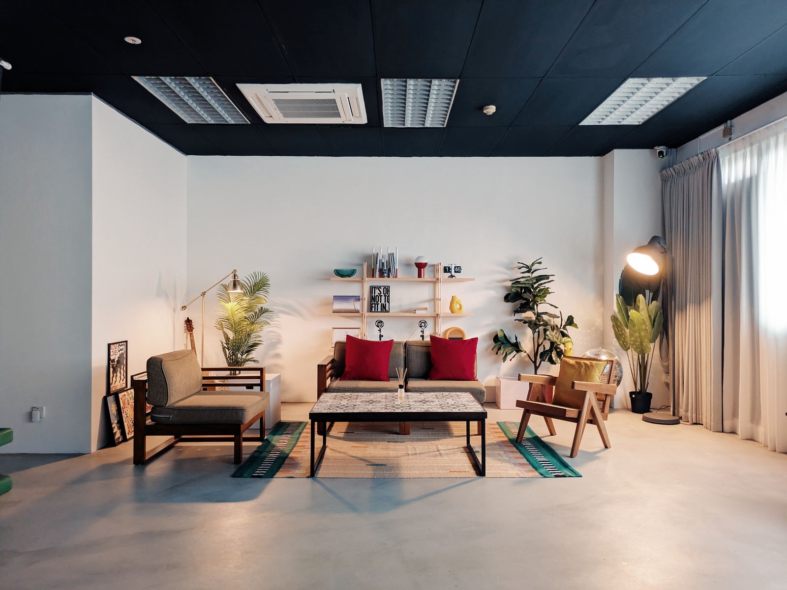 Warm, comfortable seating area inside The Portrait Room studio at Redhill Forum, Singapore